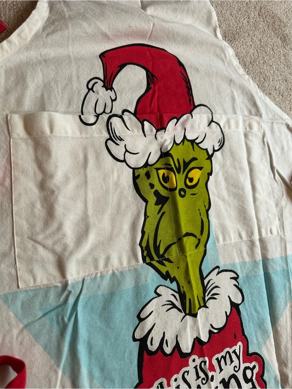 The Grinch Holiday Apron with Red Trim Resting Grinch Face Christmas Apron